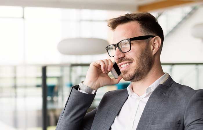 Smiling man on cell phone